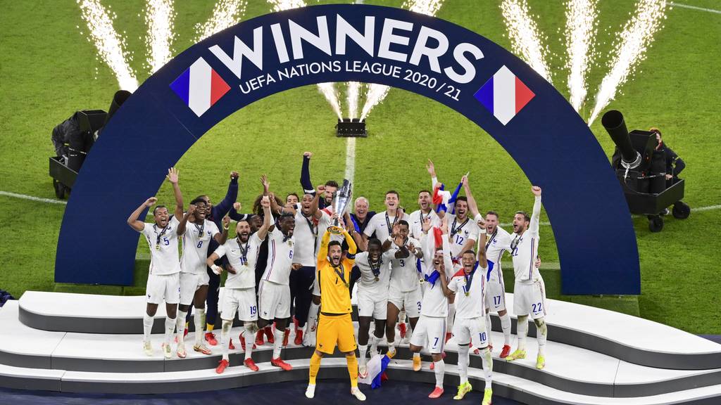 French players react with their trophy after defeating Spain to win the UEFA Nations League final soccer match at the San Siro stadium, in Milan, Italy, Sunday, Oct. 10, 2021.