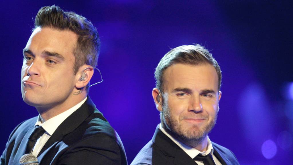 Robbie Williams (links) und Gary Barlow (rechts) feierten einst mit Take-That Erfolge mit ihrem Song «Shame». Jetzt haben sie bei Instagram den Song im Online-Duett gesungen. (Archivbild)