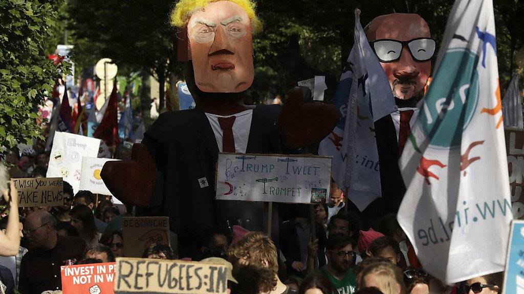 Tausende bereiten US-Präsident Donald Trump einen schrillen Empfang in Brüssel, in jener Stadt, die er als Höllenloch bezeichnet hatte.
