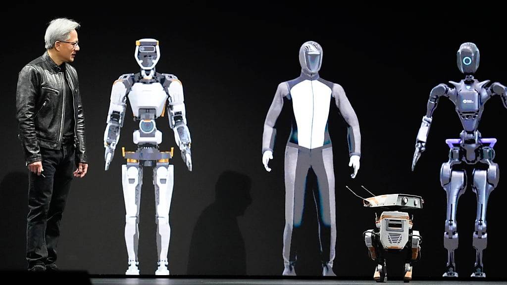 Nvidia-Chef Jensen Huang interagiert während einer Präsentation im kalifornischen San Jose mit Robotern. (Archivbild)