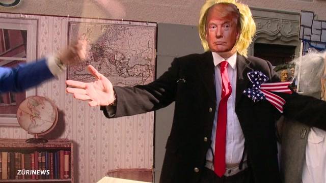 Trump zwischen kunterbunten Figuren an der Fasnacht