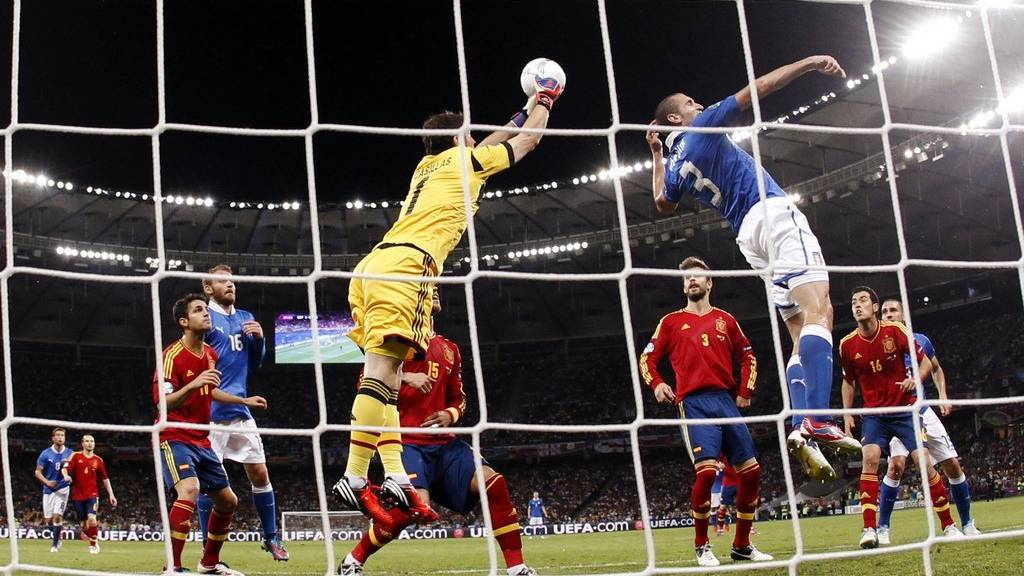 Spain goalkeeper Iker Casillas punches the ball during the Euro 2012 soccer championship final against Italy in Kiev, Ukraine, Sunday, July 1, 2012. (AP Photo/Matthias Schrader)