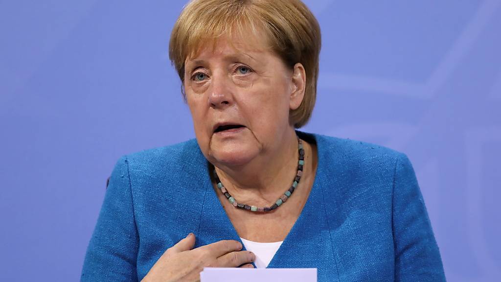 Bundeskanzlerin Angela Merkel spricht auf einer Pressekonferenz nach der Ministerpräsidentenkonferenz. Foto: Christian Mang/Reuters/Pool/dpa