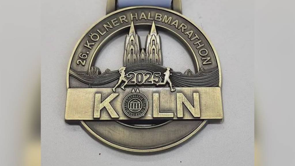 Medaille von Kölner Halbmarathon ähnelt Swiss City Marathon-Medaille – Zufall?