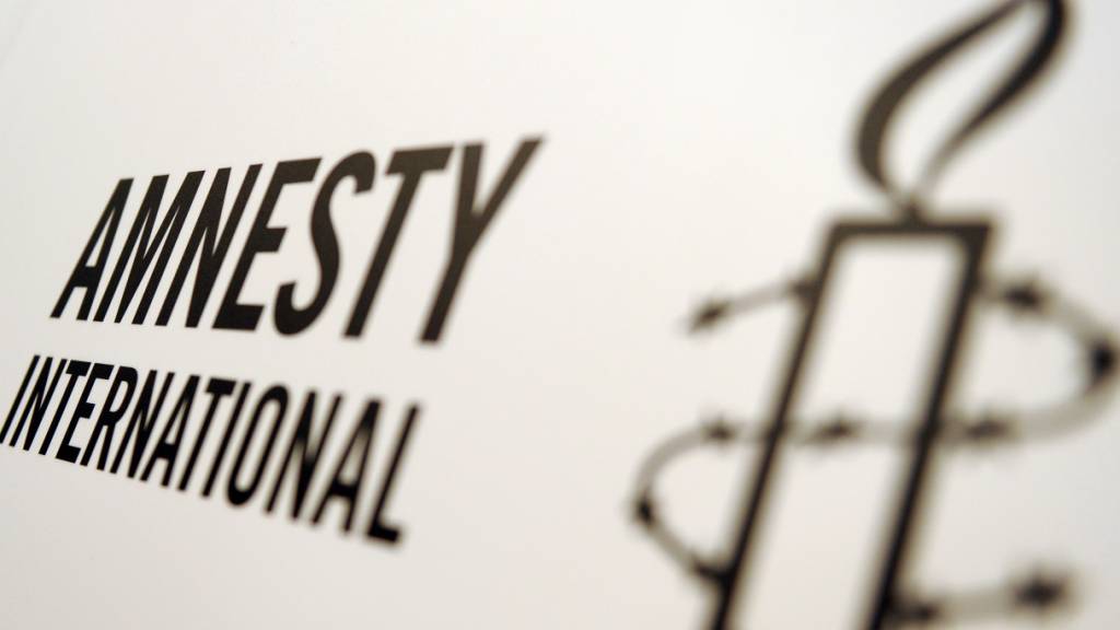 ARCHIV - Logo von Amnesty International. Foto: Britta Pedersen/dpa-Zentralbild/dpa