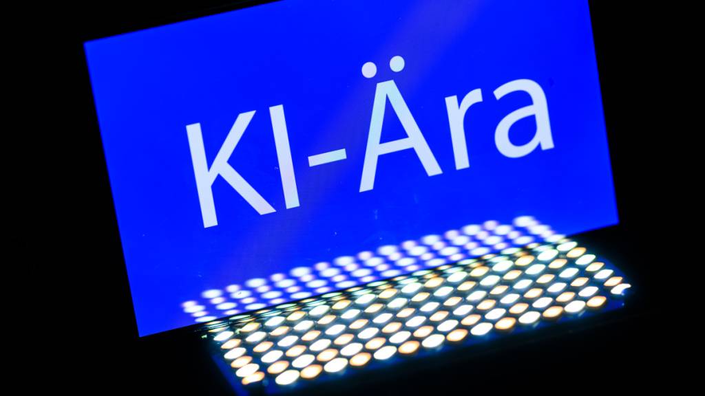 PRODUKTION - Das Wort «KI-Ära» ist auf einem Smartphone zu sehen. Das Wort des Jahres ist «KI-Ära», wie die Gesellschaft für deutsche Sprache (GfdS) bekannt gegeben hat. Eine Expertenjury wählt jährlich eine Liste von Wörtern, die den sprachlichen Nerv eines Jahres in besonderer Weise getroffen haben. Foto: Robert Michael/dpa