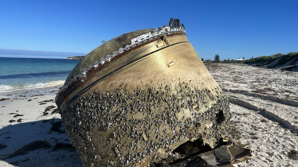 A supplied image obtained on Monday, July 17, 2023, of a  cylindrical piece of equipment that has washed up on the beach at Green Head, about 250 kilometres north of Perth, WA. (AAP Image/Supplied by Australian Space Agency) NO ARCHIVING, EDITORIAL USE ONLY