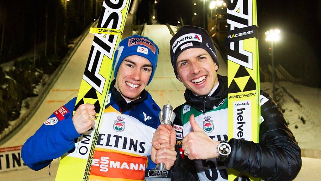 Im März 2015 standen Stefan Kraft (links) und Simon Ammann als Ex-aequo-Dritte gemeinsam auf dem Weltcup-Podest von Kuopio
