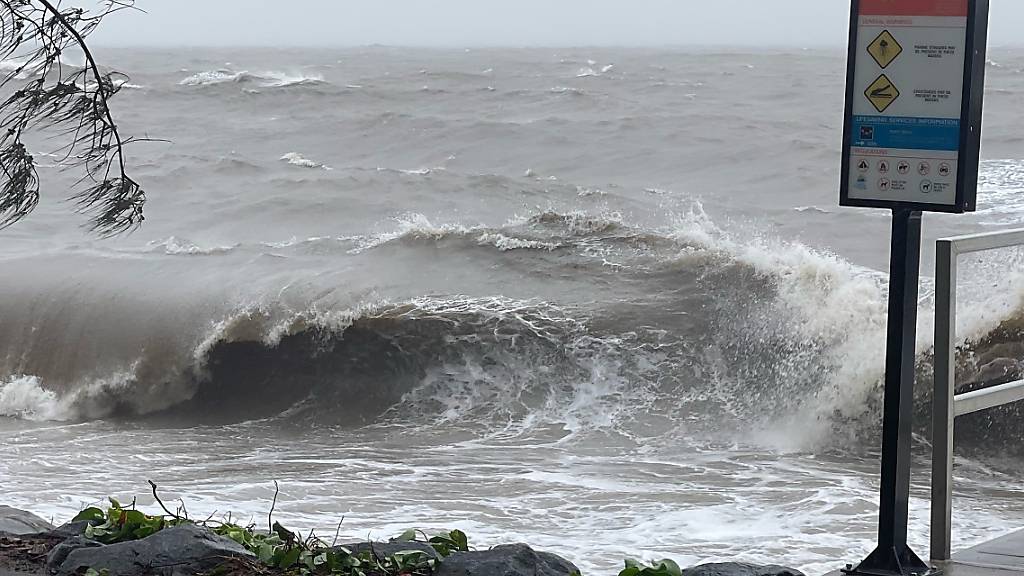 A supplied image obtained on Wednesday, December 13, 2023, shows heavy waves at Trinity Beach in Cairns. People are bunkering down and authorities are on high alert as Tropical Cyclone Jasper is on the verge of crossing the Queensland coast as a category 2 system. (AAP Image/Supplied by myPolice Greater Cairns) NO ARCHIVING, EDITORIAL USE ONLY