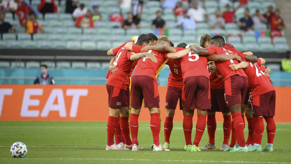 Switzerland's soccer national team players encourage each other before the Euro 2020 soccer tournament group A match between Switzerland and Turkey at the Olympic stadium, in Baku, Azerbaijan, Sunday, June 20, 2021.