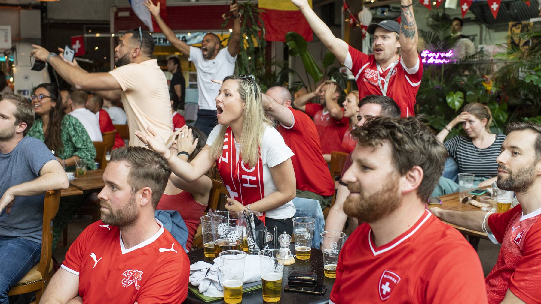 Swiss soccer fans react during the live broadcast of the UEFA EURO 2020 soccer match between Spain and Switzerland at the Amboss Rampe in Zurich, Switzerland, Friday, 2. July 2021. // Public Viewing Fussball-Fans Public-Viewing