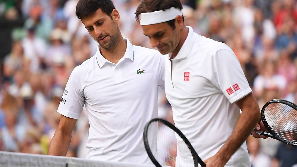 Das Spiel des Jahres: Im Wimbledonfinal verlor Roger Federer (re.) nach zwei vergebenen Matchbällen gegen Novak Djokovic. Nun kommt es, wieder in London, zur Revanche