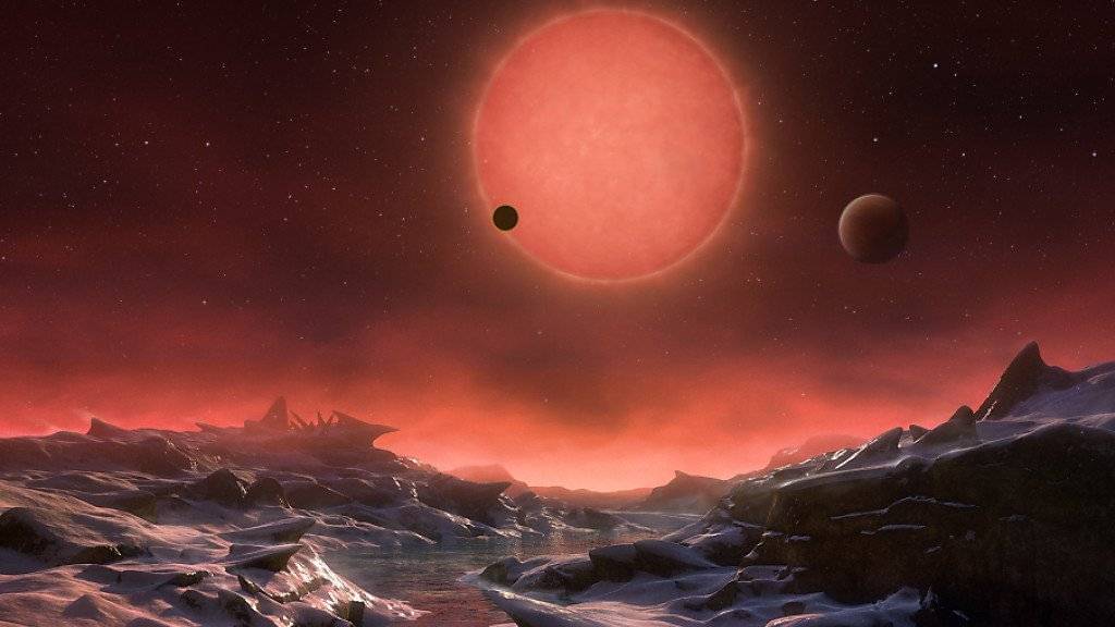So könnte nach einer Künstler-Impression einer der drei entdeckten Planeten aussehen.