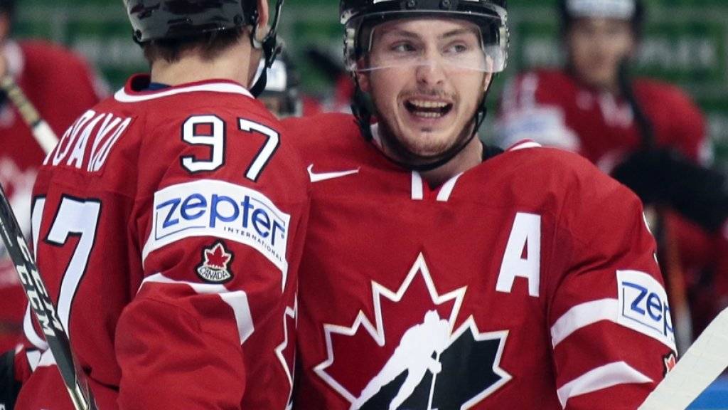 Weltmeister-Torschütze: Kanadas Connor McDavid (re.) freut sich über das Siegtor im WM-Final gegen Finnland