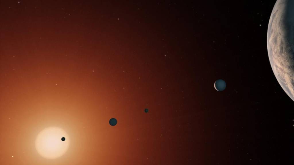 Eine künstlerische Darstellung des Trappist-1-Planetensystems. (Pressebild)