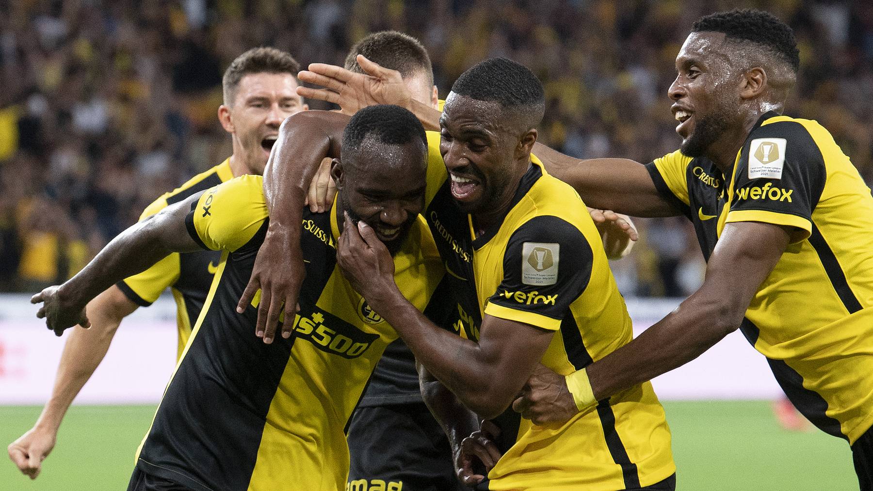 Young Boys' Nicolas Ngamaleu, Ulisses Garcia and Jordan Siebatcheu, from left, celebrate their score to 2-1 during the UEFA Champions League 2nd leg third qualifying round soccer match between BSC YB and CFR Cluj of Romania, at the Wankdorf stadium on Tuesday, August 10, 2021 in Bern, Switzerland.