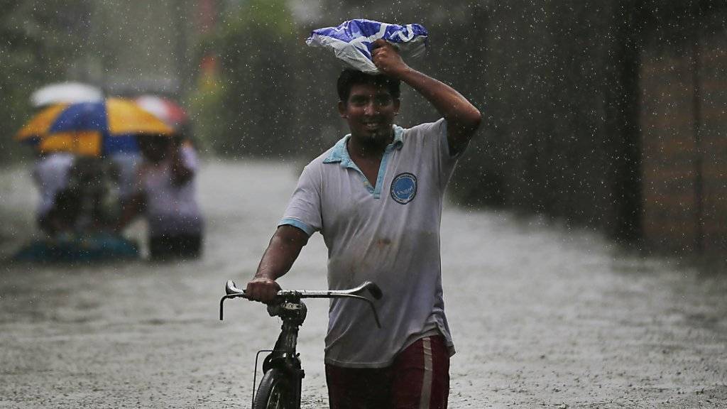 Der Monsun traf auch Sri Lankas Hauptstadt Colombo, wo Strassen und Häuser unter Wasser stehen.