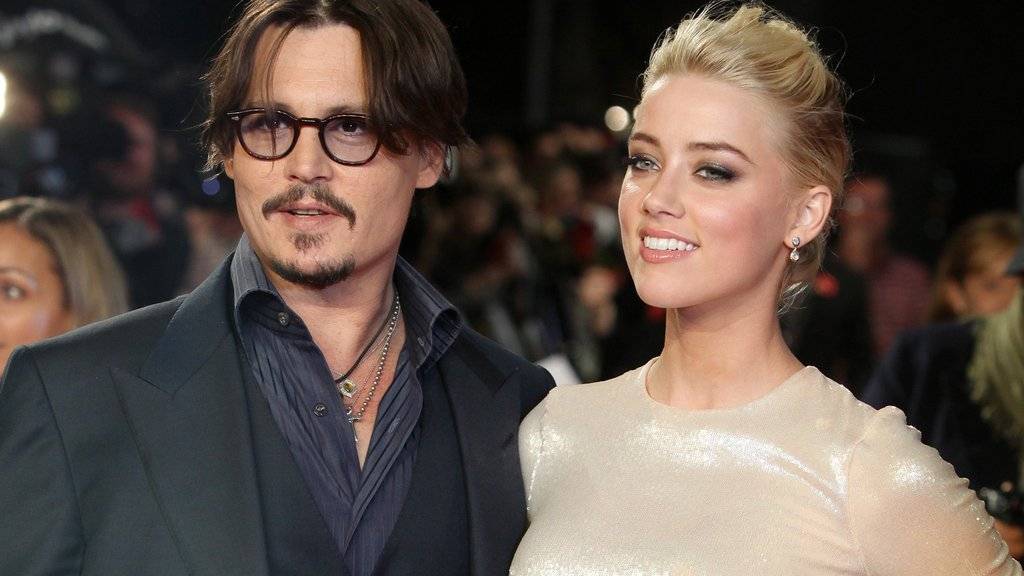 Die Abfindung nach der Trennung von Johnny Depp (links) will Amber Heard (rechts) für gute Zwecke spenden (Archiv)
