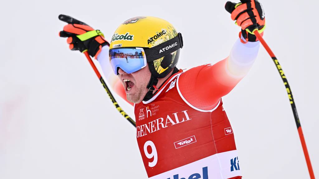 Niels Hintermann of Switzerland reacts in the finish area during the men's downhill race at the Alpine Skiing FIS Ski World Cup in Kitzbuehel, Austria, Friday, January 20, 2023.