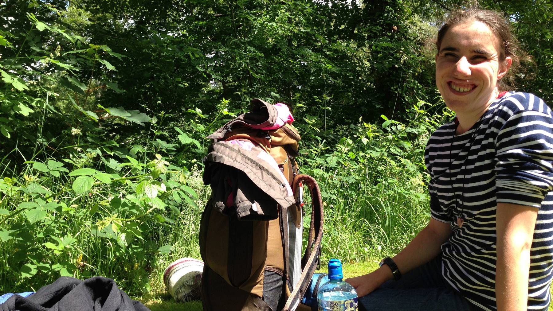 laila next to her backpack on the campside in caernarfon wales 2013 020