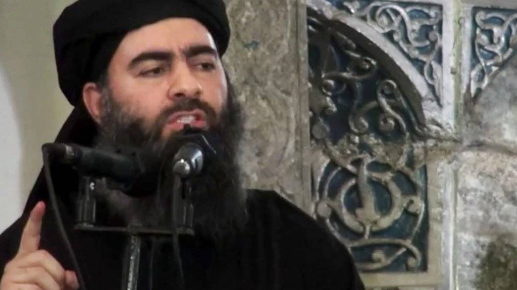 Das Gesicht des Terrors: Abu Bakr al-Baghdadi, Chef des so genannten Islamischen Staates (IS) und selbsternannter Kalif - also: wörtlich Nachfolger des Propheten Mohammed (in einer Aufnahme vom Juli 2014).