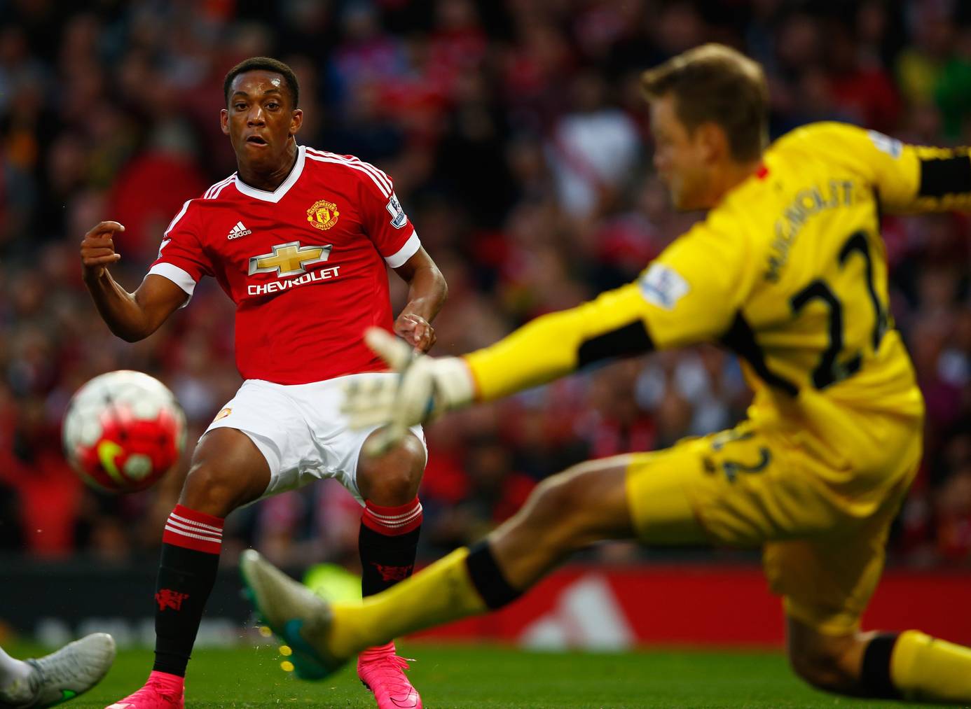 MANCHESTER, ENGLAND - SEPTEMBER 12:  Anthony Martial of Manchester United scores past Simon Mignolet of Liverpool for his team's third goal during the Barclays Premier League match between Manchester United and Liverpool at Old Trafford on September 12, 2015 in Manchester, United Kingdom.  (Photo by Shaun Botterill/Getty Images)