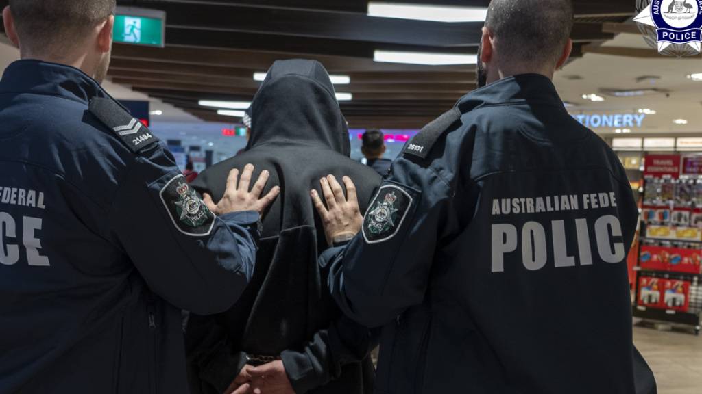 A supplied image obtained Sunday, May 28, 2023 of a 35-year-old Sydney man is arrested at Sydney International Airport after allegedly orchestrating the largest heroin importations in recent history. (AAP Image/AFP) NO ARCHIVING, EDITORIAL USE ONLY