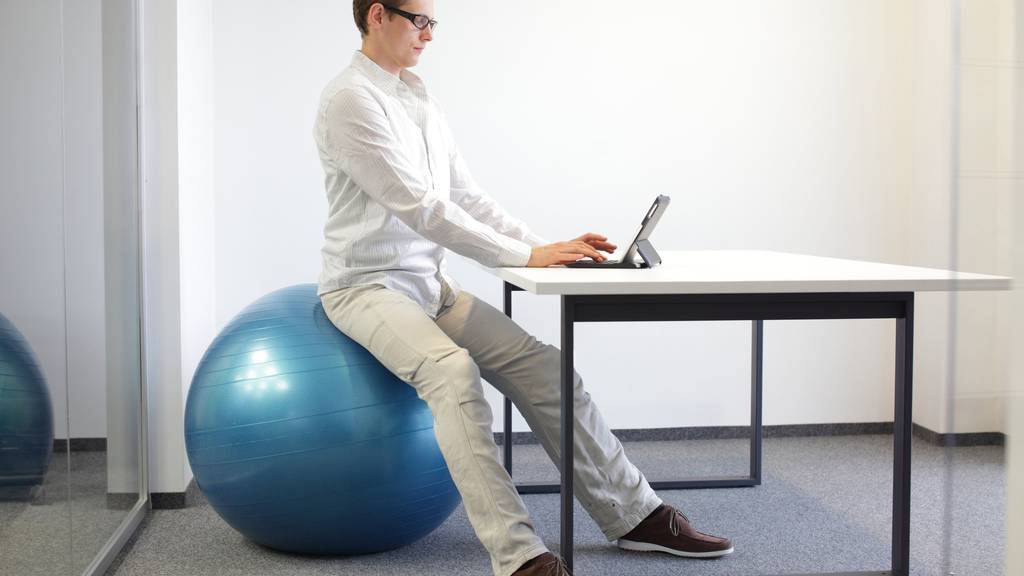 young man  - correct sitting position in office work