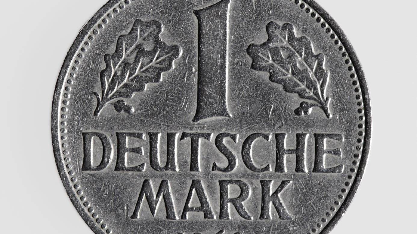 Single german coin - one deutsche mark aginst white background