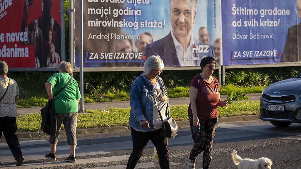 Wahlplakate in Zagreb: Kroatien wählt ein neues Parlament. Foto: Darko Bandic/AP/dpa