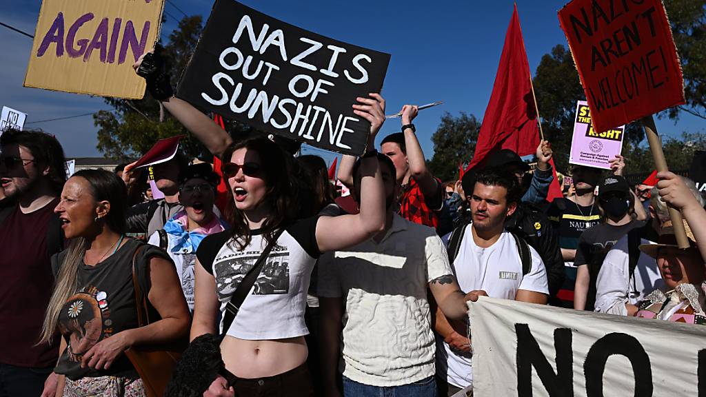 Protesters chant during a Drive the Nazis out of Melbourne protest in Melbourne, Saturday, September 23, 2023. A Victorian ban on the Nazi salute is one step closer with legislation to be introduced to parliament. (AAP Image/James Ross) NO ARCHIVING