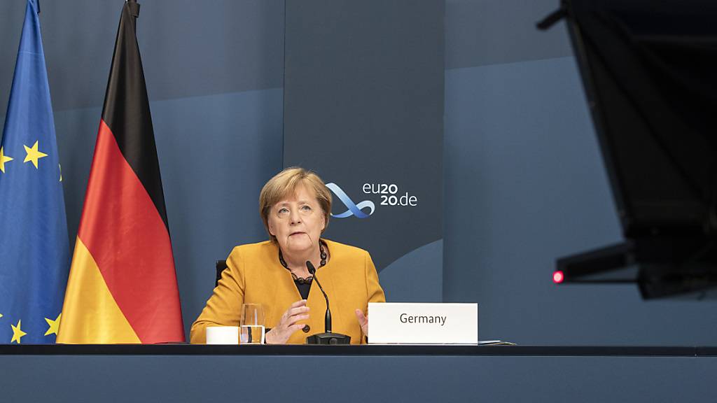 HANDOUT - Angela Merkel, Bundeskanzlerin, nimmt im Rahmen des beim virtuellen G20-Gipfel an einer Videokonferenz im Kanzleramt teil. Foto: Guido Bergmann/Bundesregierung/dpa - ACHTUNG: Nur zur redaktionellen Verwendung im Zusammenhang mit der aktuellen Berichterstattung und nur mit vollständiger Nennung des vorstehenden Credits