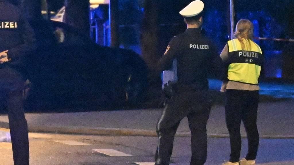 Polizisten am Einsatzort in München. Foto: Felix Hörhager/dpa