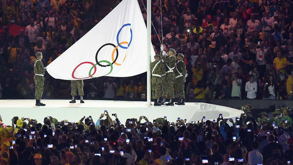 Wo wird die olympische Flagge 2026 gehisst werden?