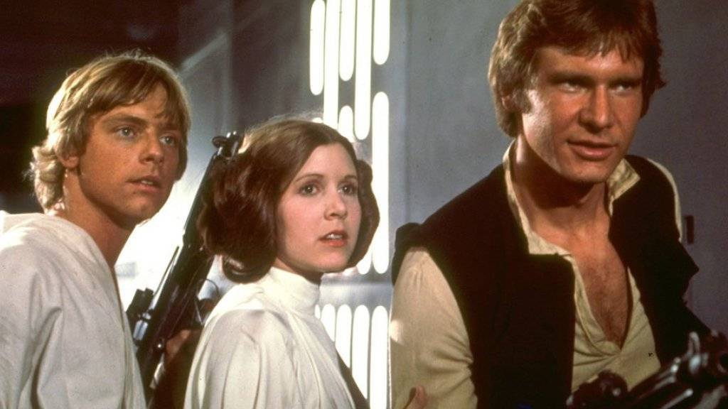 Harrison Ford (rechts neben Mark Hamill und Carrie Fisher) erhielt 1977 als Han Solo (Bild) nur 1000 Dollar die Woche. Mittlerweile ist er wohl etwas teurer (Archiv).