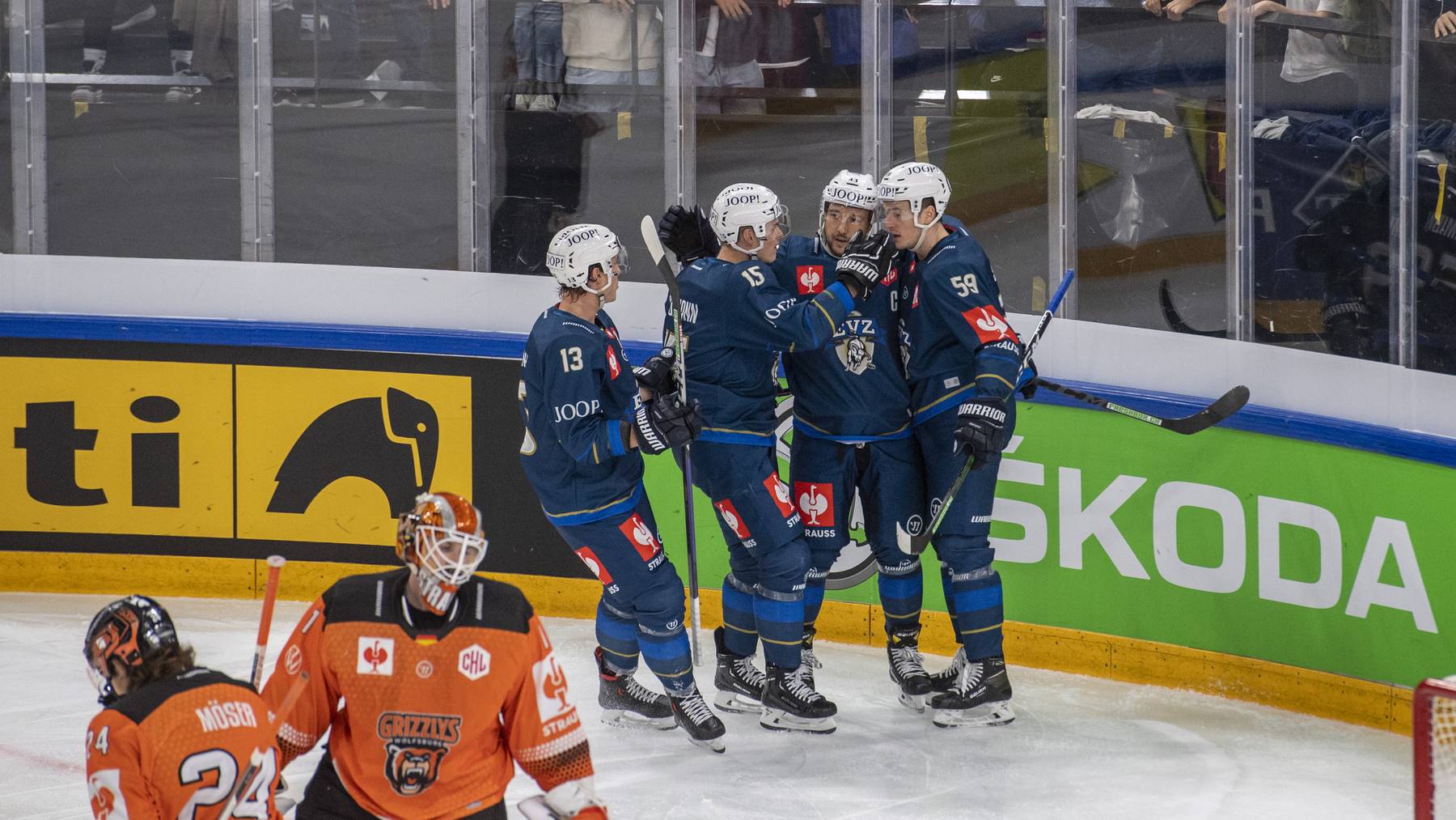 The Players from Zug with Dario Wuethrich, Gregory Hofmann, Samuel Kreis and Dario Simion, from left, reacts after the 1:0 goal during the Champions Hockey League group B match between Switzerland's EV Zug and Grizzlys Wolfsburg of Germany, in Zug, Switzerland, Saturday, September 8, 2022.