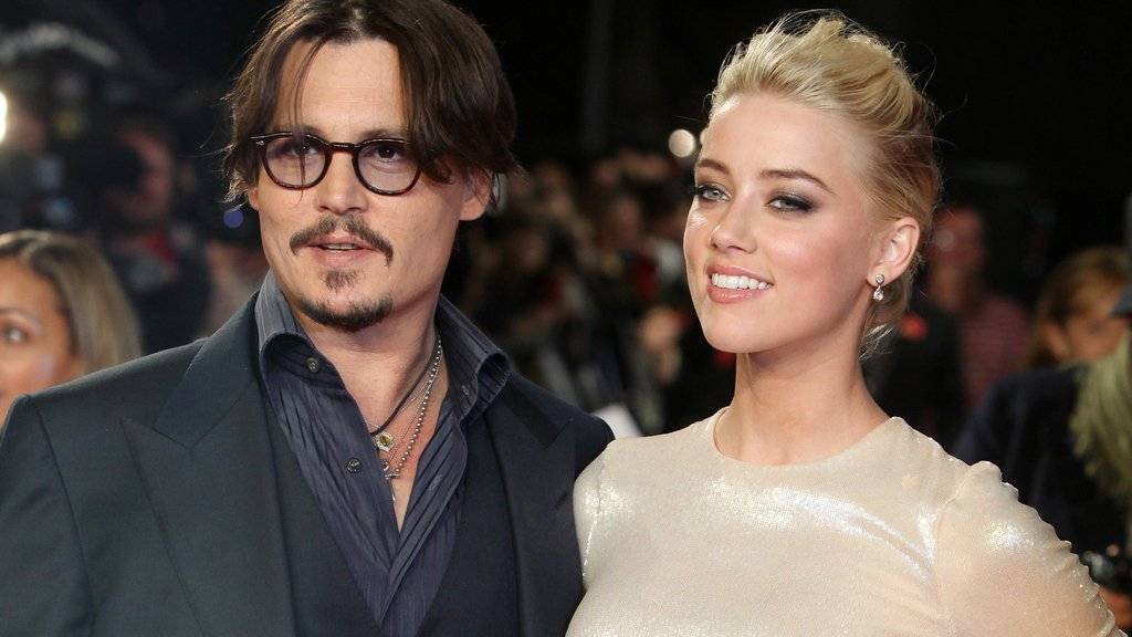 Das Liebesglück hat Johnny Depp (links) und Amber Heard definitiv verlassen. Nun streiten die beiden um eine Millionenabfindung (Archiv)