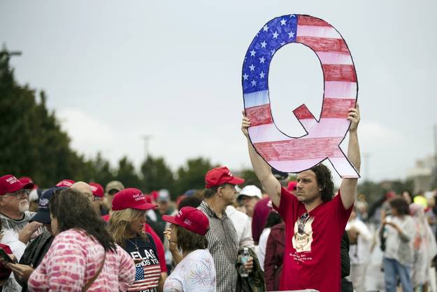 More and more Q-Anon followers appear at Trump events.