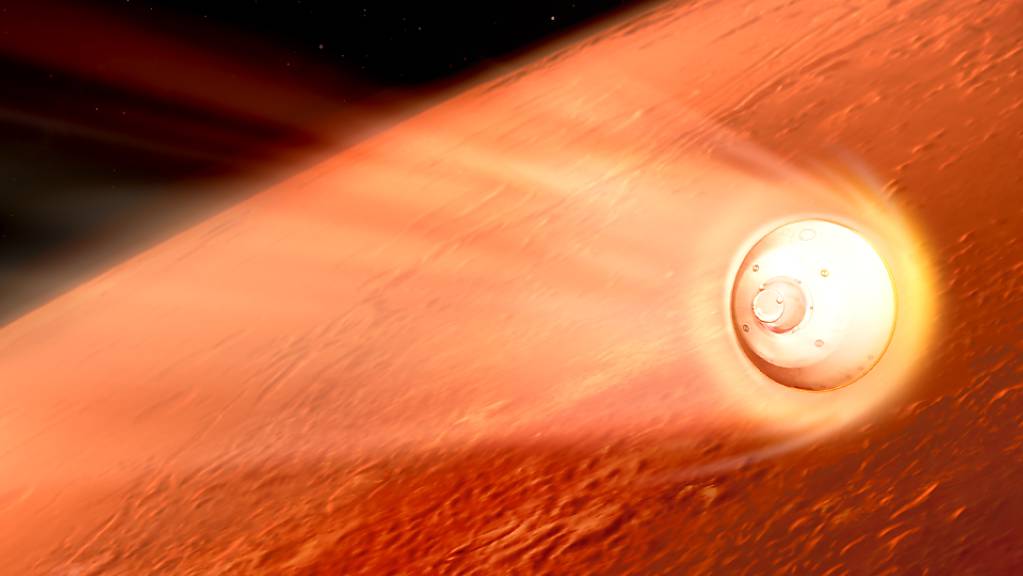 HANDOUT - In dieser Illustration ihres Landeanflugs auf den Mars verlangsamt sich die Sonde mit dem «Perseverance»-Rover der NASA. Foto: NASA/JPL-Caltech/dpa - ACHTUNG: Nur zur redaktionellen Verwendung und nur mit vollständiger Nennung des vorstehenden Credits
