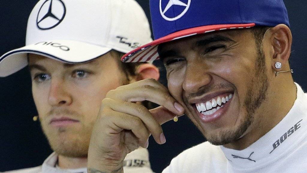 Diese zwei werden keine Freunde mehr: Lewis Hamilton freut sich über den WM-Titel, Teamkollege Nico Rosberg freut sich nicht unbedingt mit