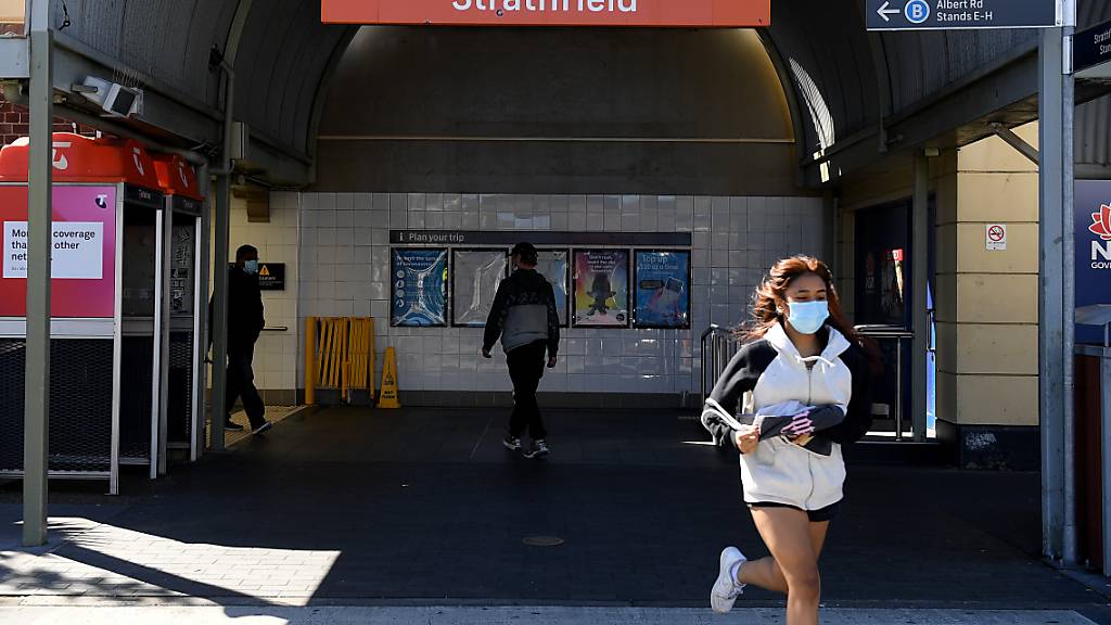 People are seen in Strathfield, Sydney, Friday, August 13, 2021. More than 80 per cent of the NSW population is now in lockdown as the state struggles to stop the spread of the Delta COVID-19 strain beyond Greater Sydney and into the regions. (AAP Image/Dan Himbrechts) NO ARCHIVING