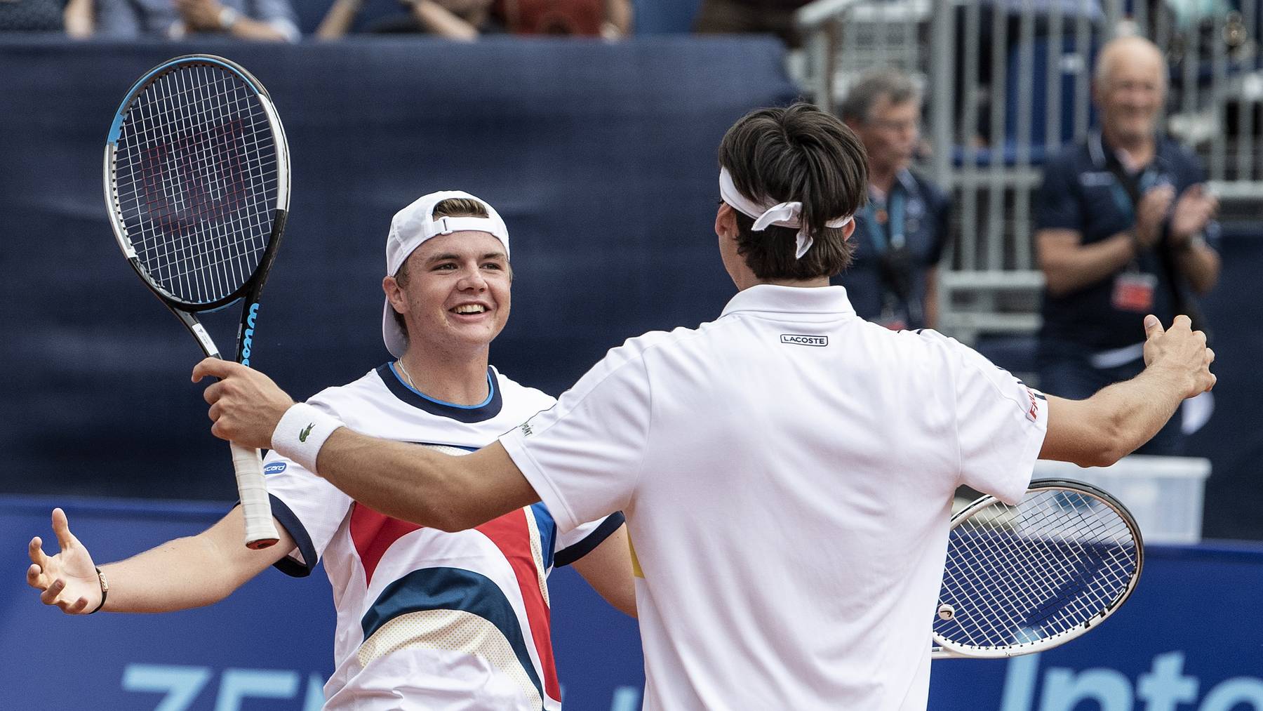 Swiss players Marc Andrea Huesler (R) and Dominic Stephan Stricker (L) celebrate after defeating Benoit Paire and Arthur Rinderknech of France in their doubles semi final match of the Swiss Open tennis tournament in Gstaad, Switzerland, 24 July 2021.