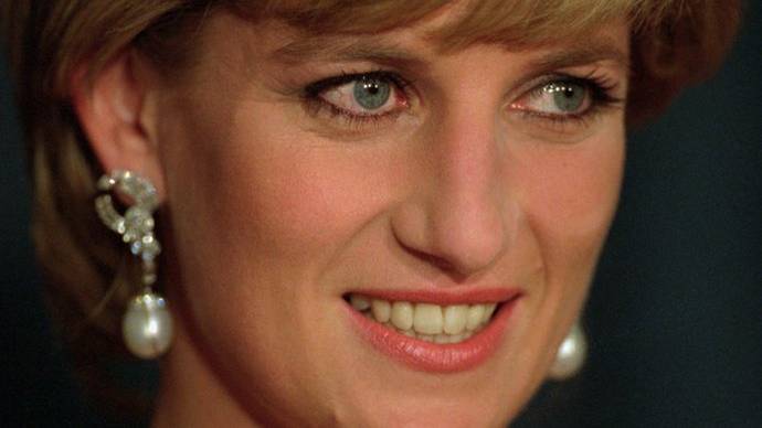Princess Diana flashes a smile at United Cerebral Palsy's annual dinner at the New York Hilton on December 11, 1995. Diana died after a car accident Sunday, August 31, 1997, in Paris, according to the British news agency Press Association. (AP Photo/Mark Lennihan, pool)