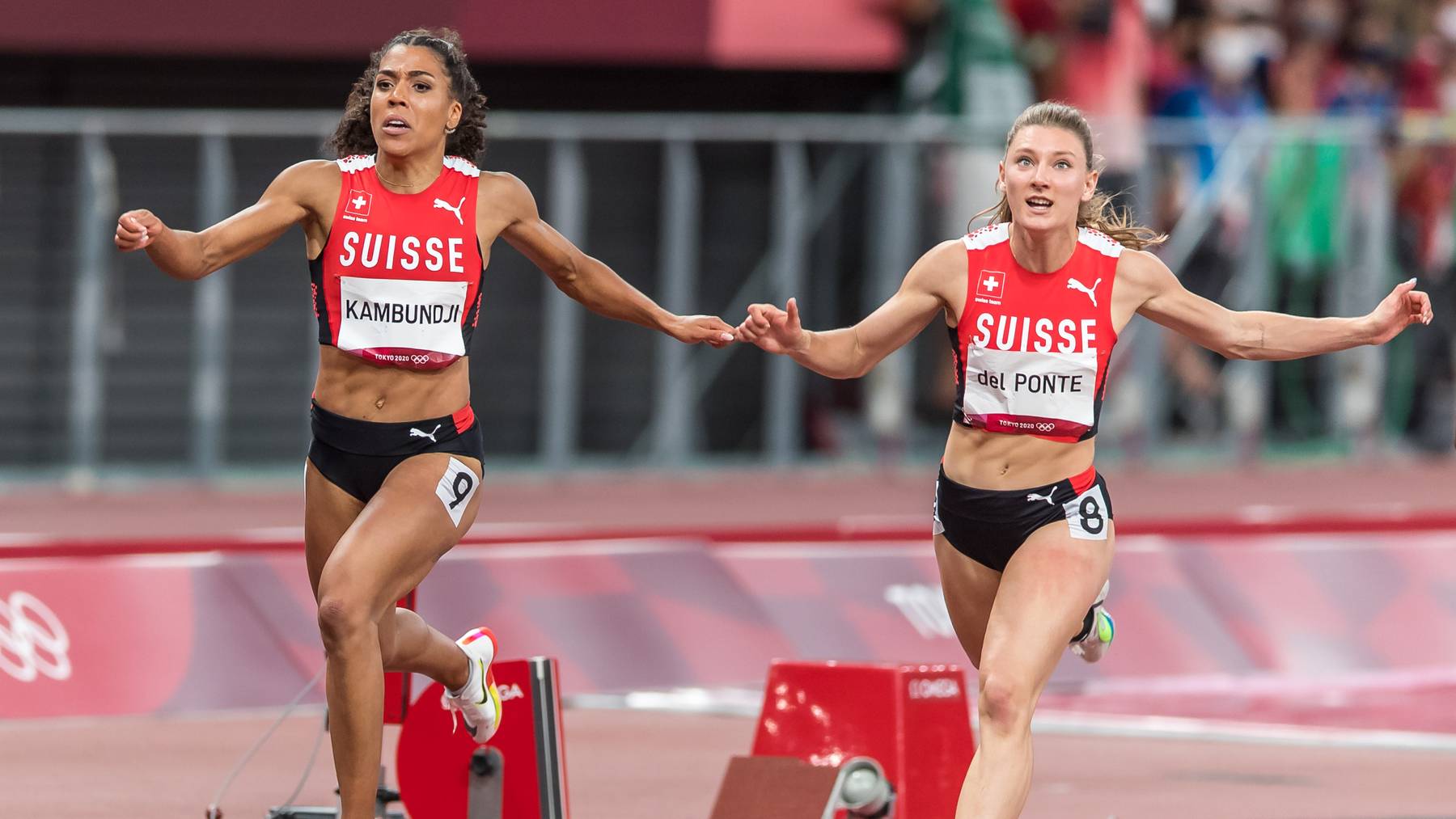 Ajla Del Ponte, right, and Mujinga Kambundji, left, finish the final of the women's 100 m in ranks five (Del Ponte) and six (Kambundji) at the 2020 Tokyo Summer Olympics Games in Tokyo, Japan, on Saturday, July 31, 2021.