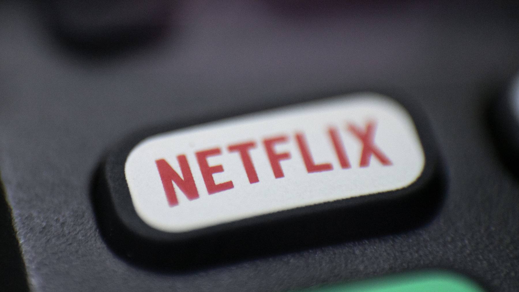This Aug. 13, 2020, photo shows a logo for Netflix on a remote control in Portland, Ore.