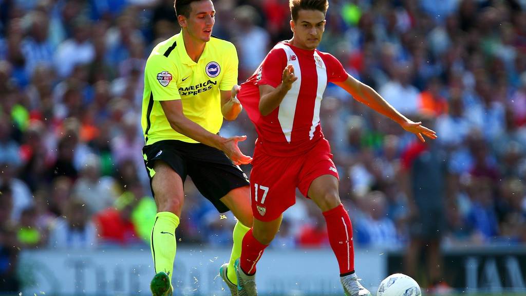 BRIGHTON, ENGLAND - AUGUST 02:  Lewis Dunk of Brighton tugs the shirt of Denis Suarez of Sevilla during the Pre Season Friendly between Brighton & Hove Albion and Seville at Amex Stadium on August 2, 2015 in Brighton, England.  (Photo by Jordan Mansfield/Getty Images)