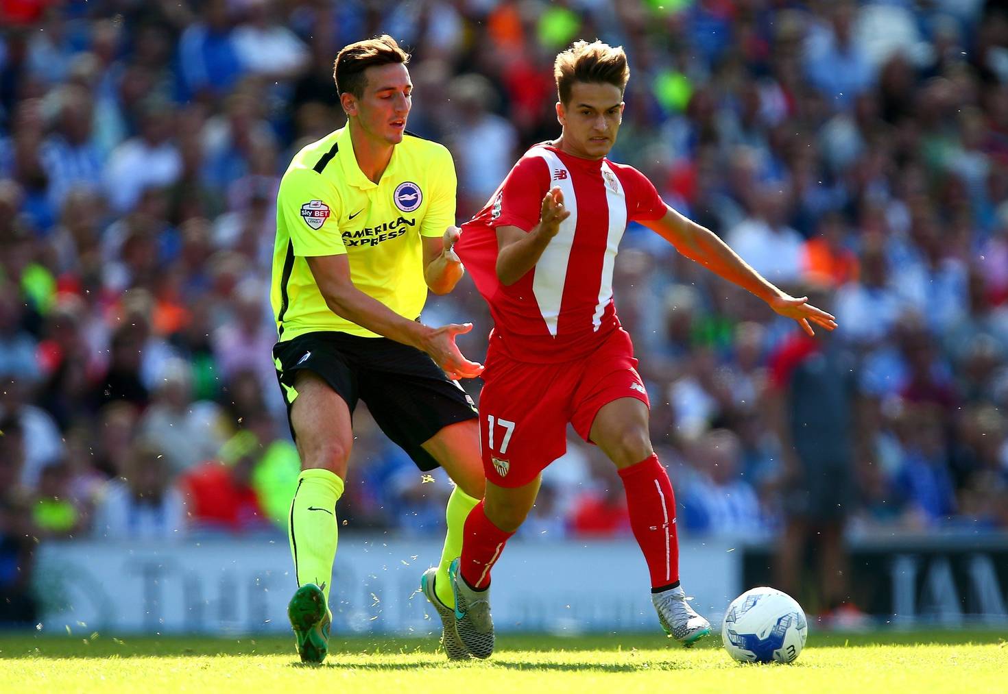 BRIGHTON, ENGLAND - AUGUST 02:  Lewis Dunk of Brighton tugs the shirt of Denis Suarez of Sevilla during the Pre Season Friendly between Brighton & Hove Albion and Seville at Amex Stadium on August 2, 2015 in Brighton, England.  (Photo by Jordan Mansfield/Getty Images)