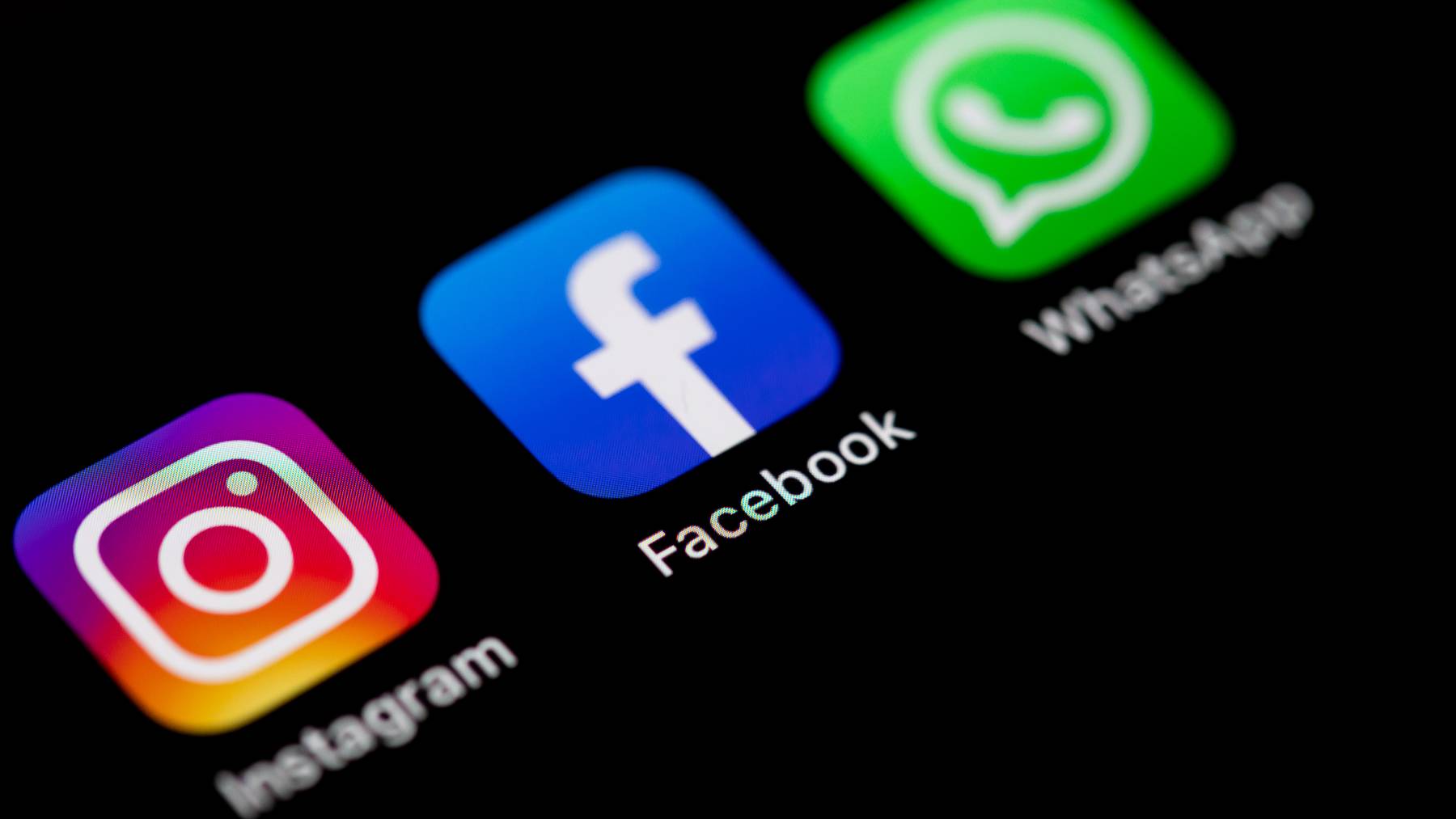 In this photo illustration, The Instagram, Facebook und WhatsApp logos on the screen of an iPhone on March 09, 2021 in Kirchheim unter Teck, Germany.