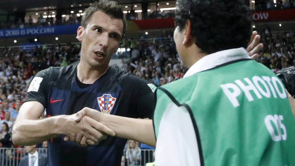 Erhielt von Kroatiens Torschütze Mario Mandzukic persönlich eine Entschuldigung dafür, dass er mitten in die Jubelszenen geriet: der AFP-Fotograf Yuri Cortez