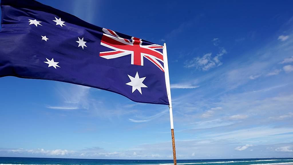 An Australian flag is seen at Main Beach on the Gold Coast, Tuesday, April 7, 2020. Australian Prime Minister Scott Morrison today urged all Australians to stay home over the Easter weekend amid the countrys coronavirus restrictions. Locally, the Gold Coast City Council is to close all car parks to beaches on the Gold Coast in a deterrent to travellers heading to the beach over the Easter weekend. (AAP Image/Dave Hunt) NO ARCHIVING